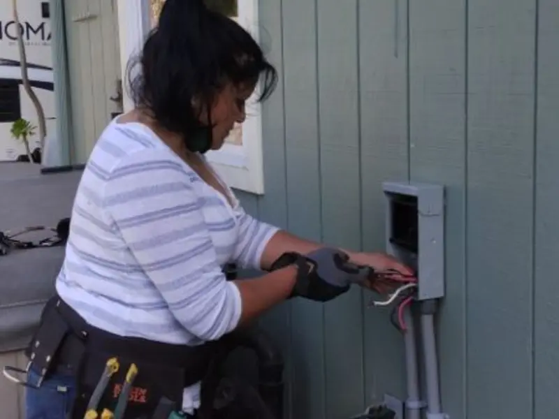 Licensed electrician wiring an exterior subpanel in Bellevue