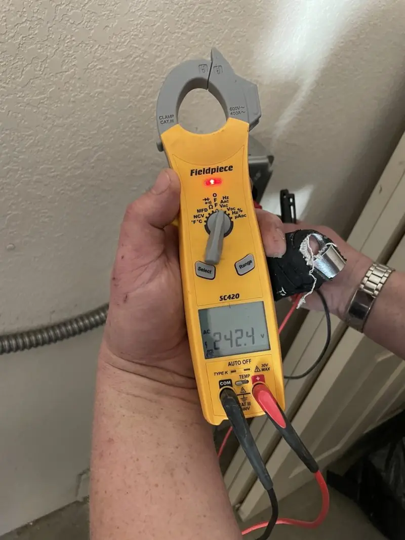 Voltage testing with clamp meter during Whole House Surge Protector in Bellevue